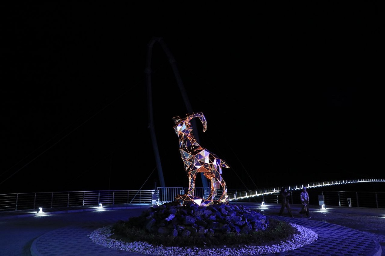 Zomin Ropeway in Uzbekistan - a statue on the deck of a ship at night.