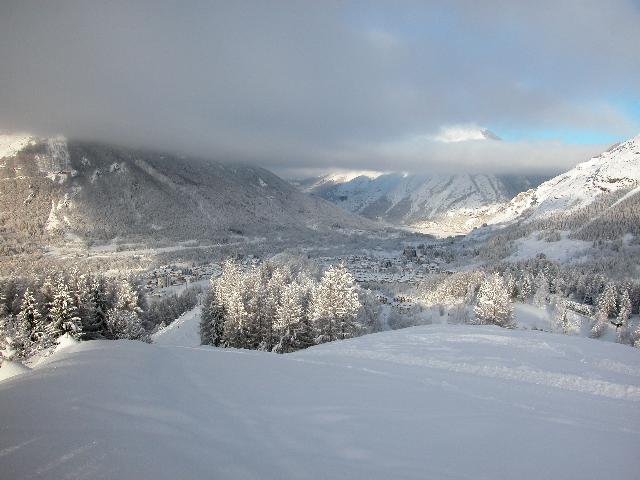 Winter sports scene in Entracque, Piedmont, Italy, featuring a charming chalet amidst the snowy landscape of a ski resort.