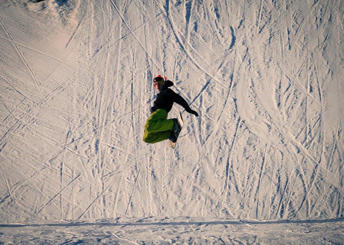 Birch Hill Ski & Snowboard Area in USA - a person in the air on a snowboard.