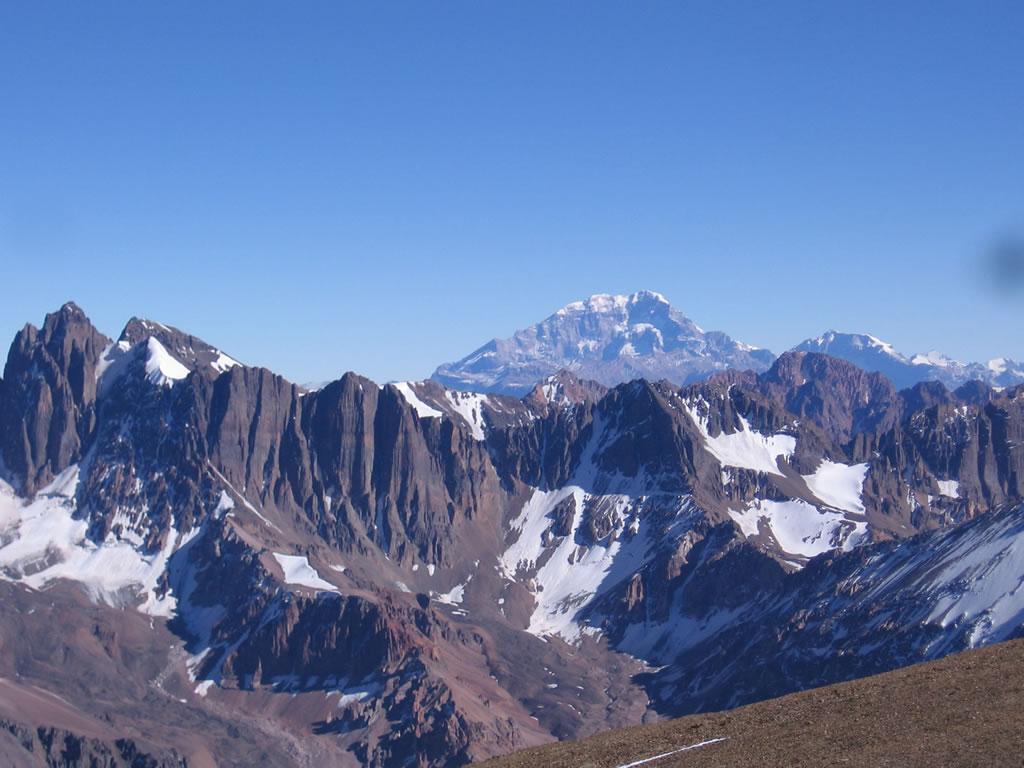 Vallecitos in Argentina - a mountain range with snow capped mountains in the background.