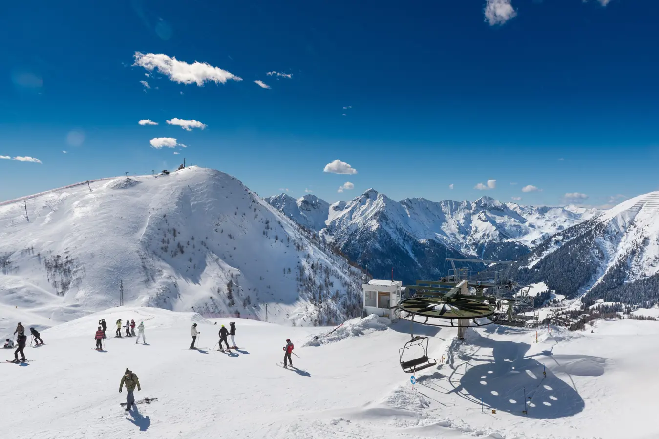 Piazzatorre in Italy - a group of people skiing down a mountain.