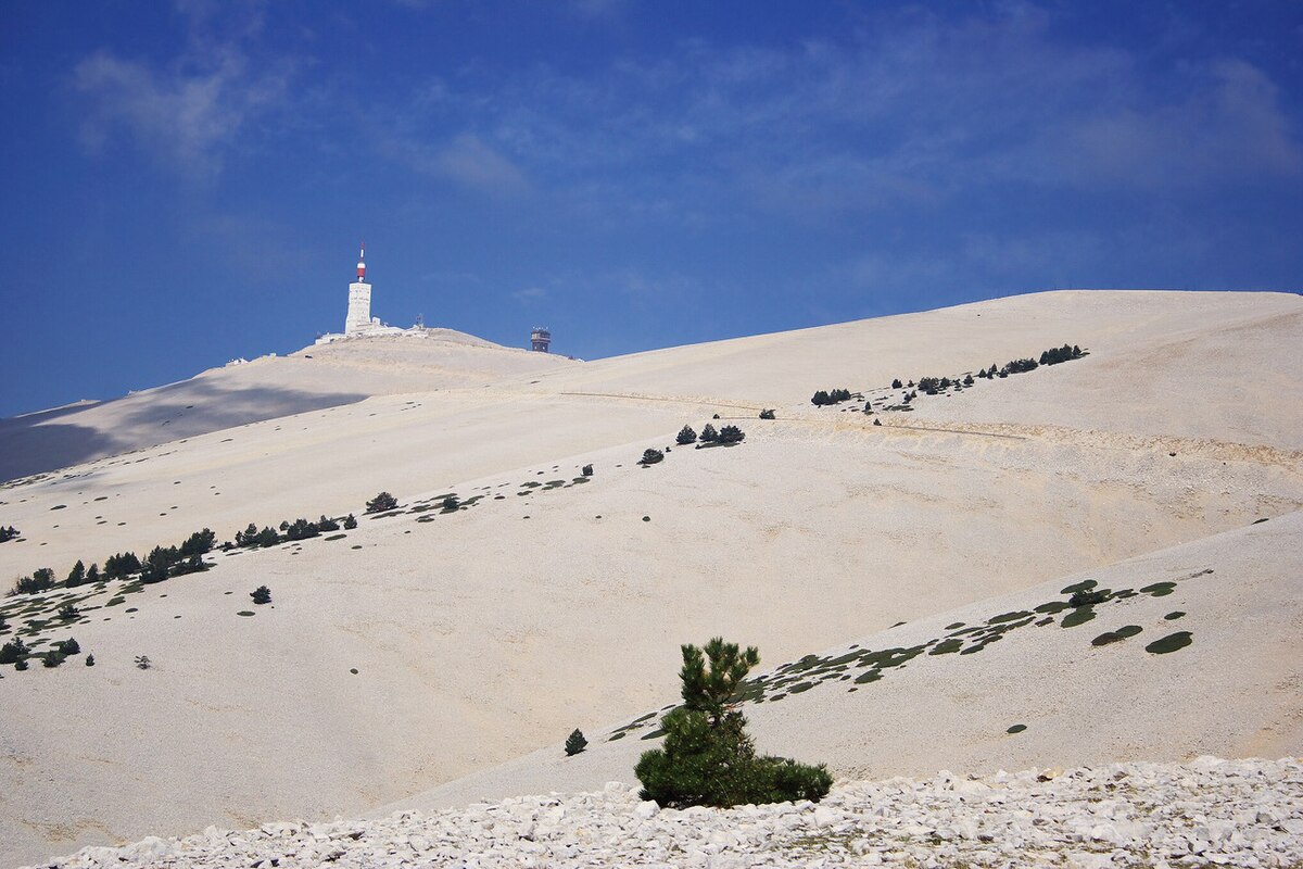 Mont Serein in France - a white lighthouse on top of a hill.