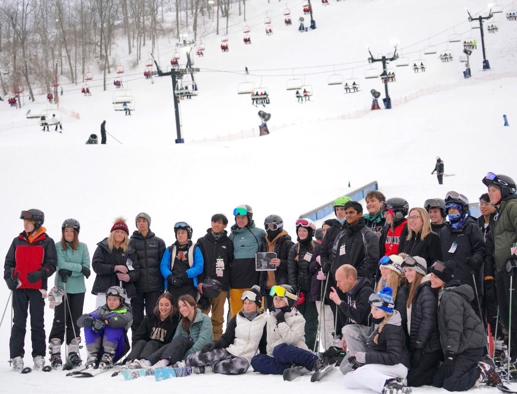 Perfect North Slopes in USA - a group of people sitting in the snow.