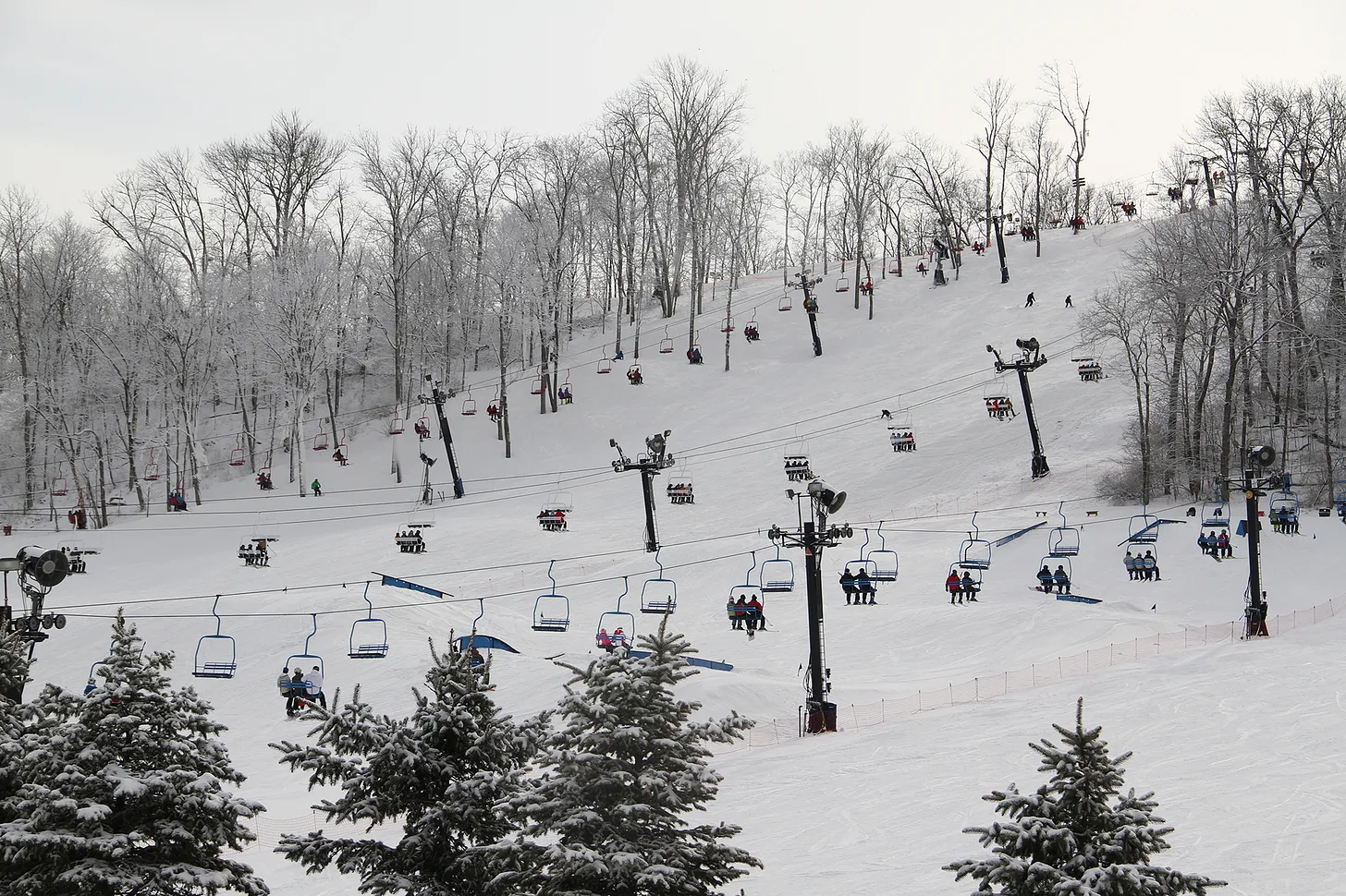 Perfect North Slopes in USA - a ski slope with people skiing down it.