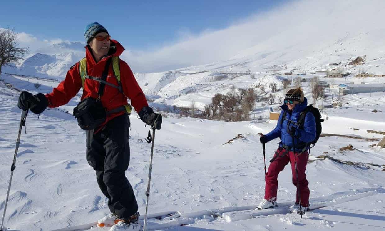 A family enjoying skiing in Dohuk Khalifan Iraq. A skier presumably a child is learning to ski in the backdrop of a challet. The scene captures winter sports in action.