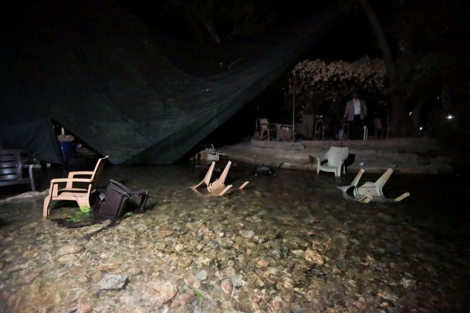 Dohuk in Iraq - a group of people sitting in chairs under a tent.