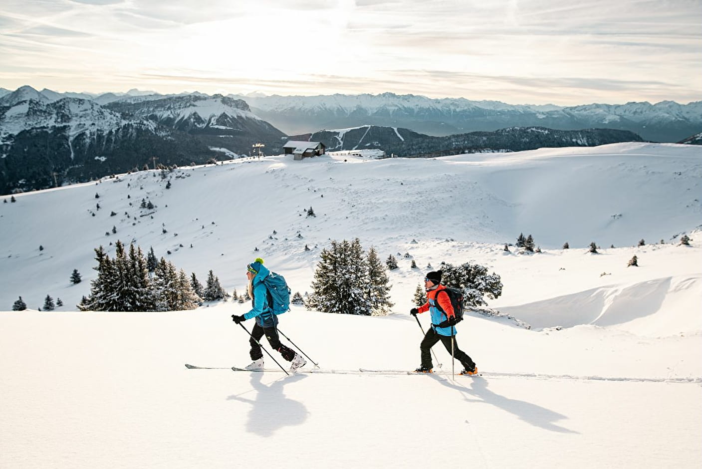 Winter sports scene at Aillon-le-Jeune in Savoie Mont Blanc, France, featuring a group of skiers, possibly a family, enjoying their time on snowy slopes.