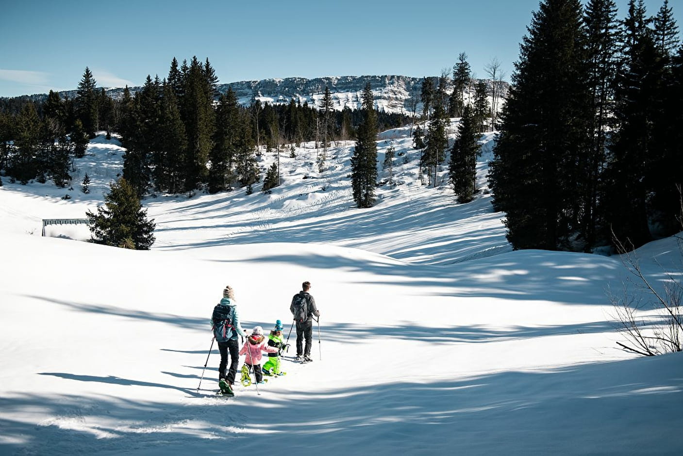 Aillon-le-Jeune in France - a man and a child are walking in the snow.