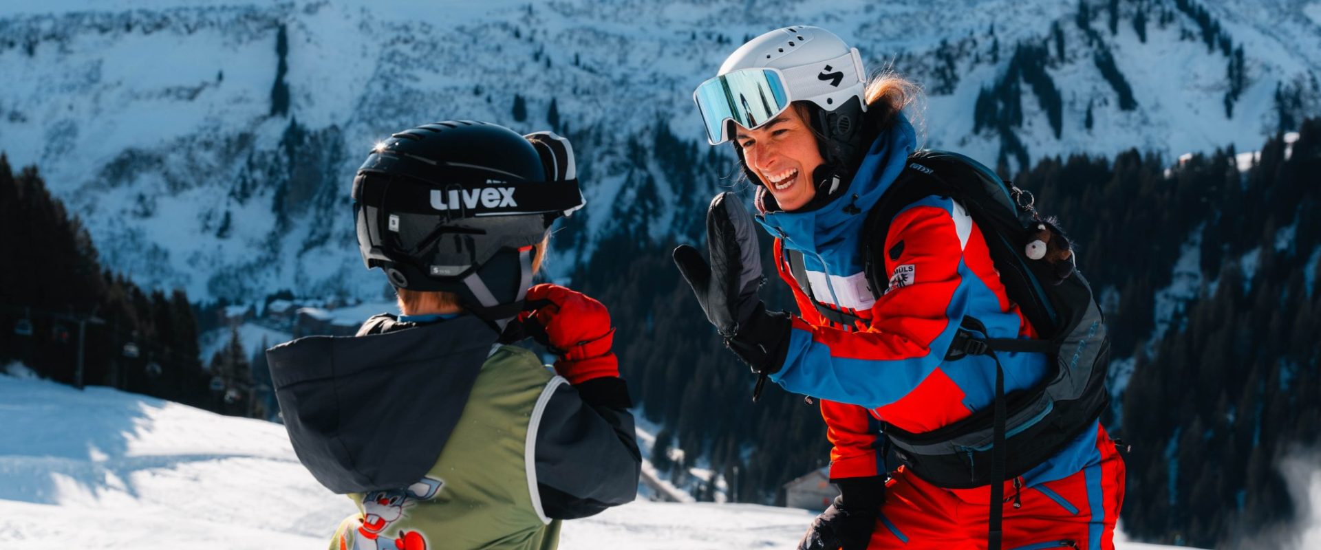 Faschina in Austria - two people in ski gear on a snowy slope.
