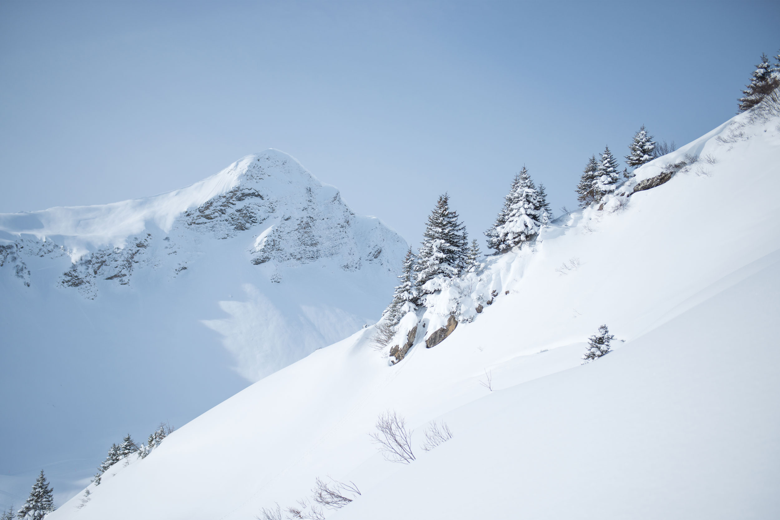 Faschina in Austria - a person skiing down a snow covered mountain.