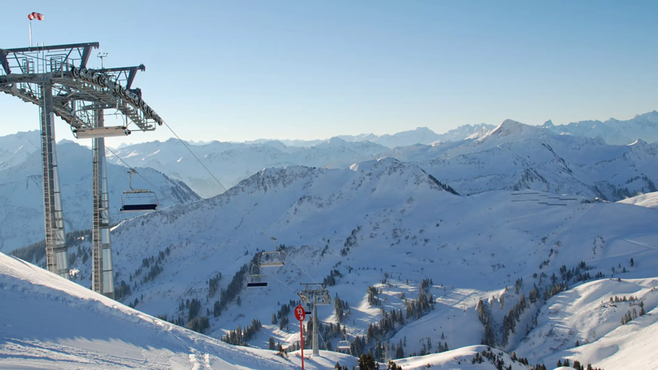 Faschina in Austria - a ski lift going up a snowy mountain.