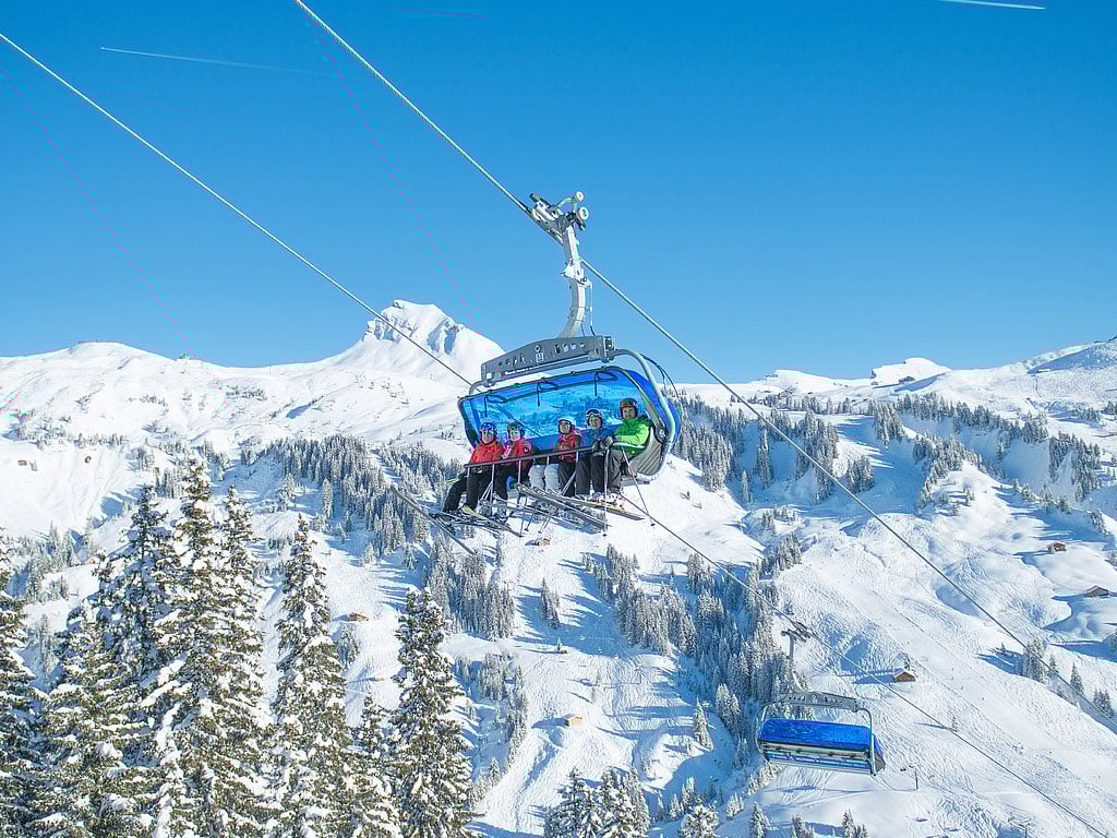 Faschina in Austria - a ski lift going up a snowy mountain.