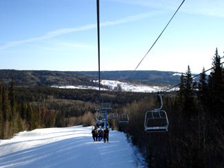 Whispering Pines in Canada - a ski lift going up the mountain.