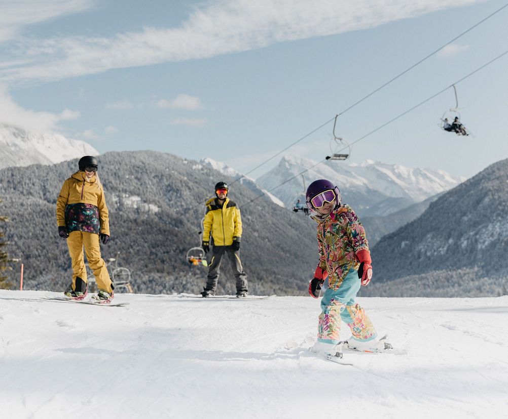 Katzenkopf Leutasch in Austria - a group of people skiing down a mountain.