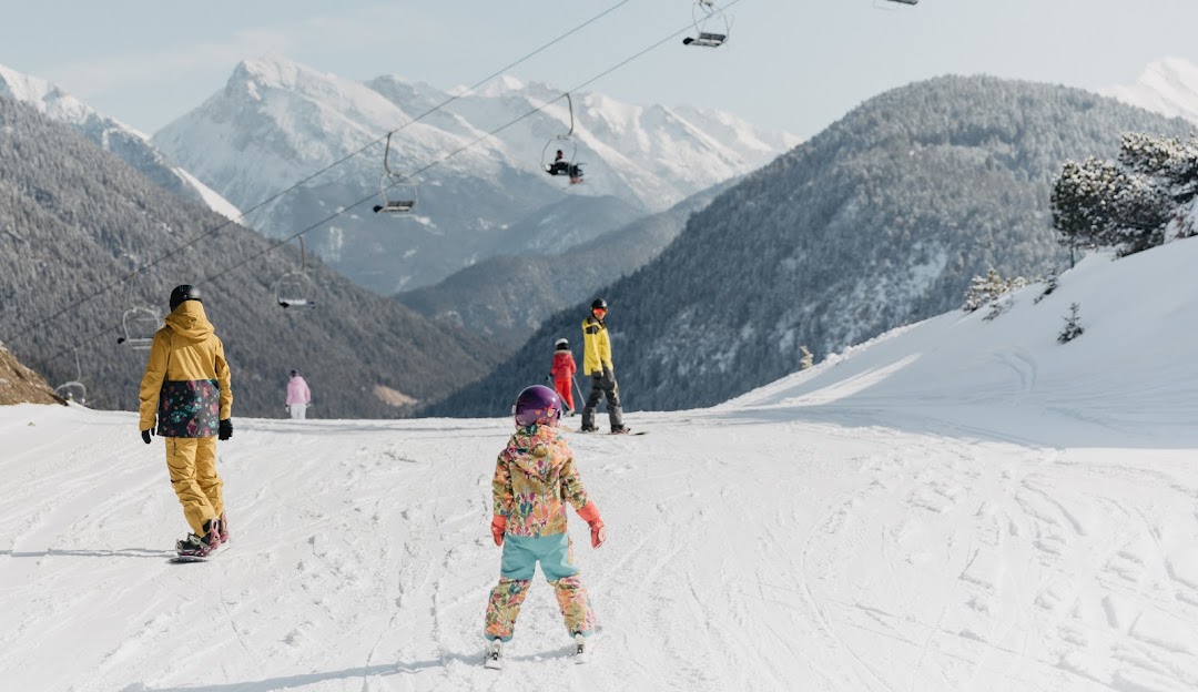 Katzenkopf Leutasch in Austria - a group of people skiing down a snow covered mountain.