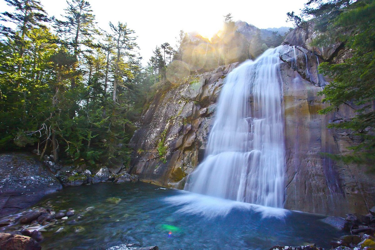 Pont d'Espagne in France - a waterfall in the middle of a forest.