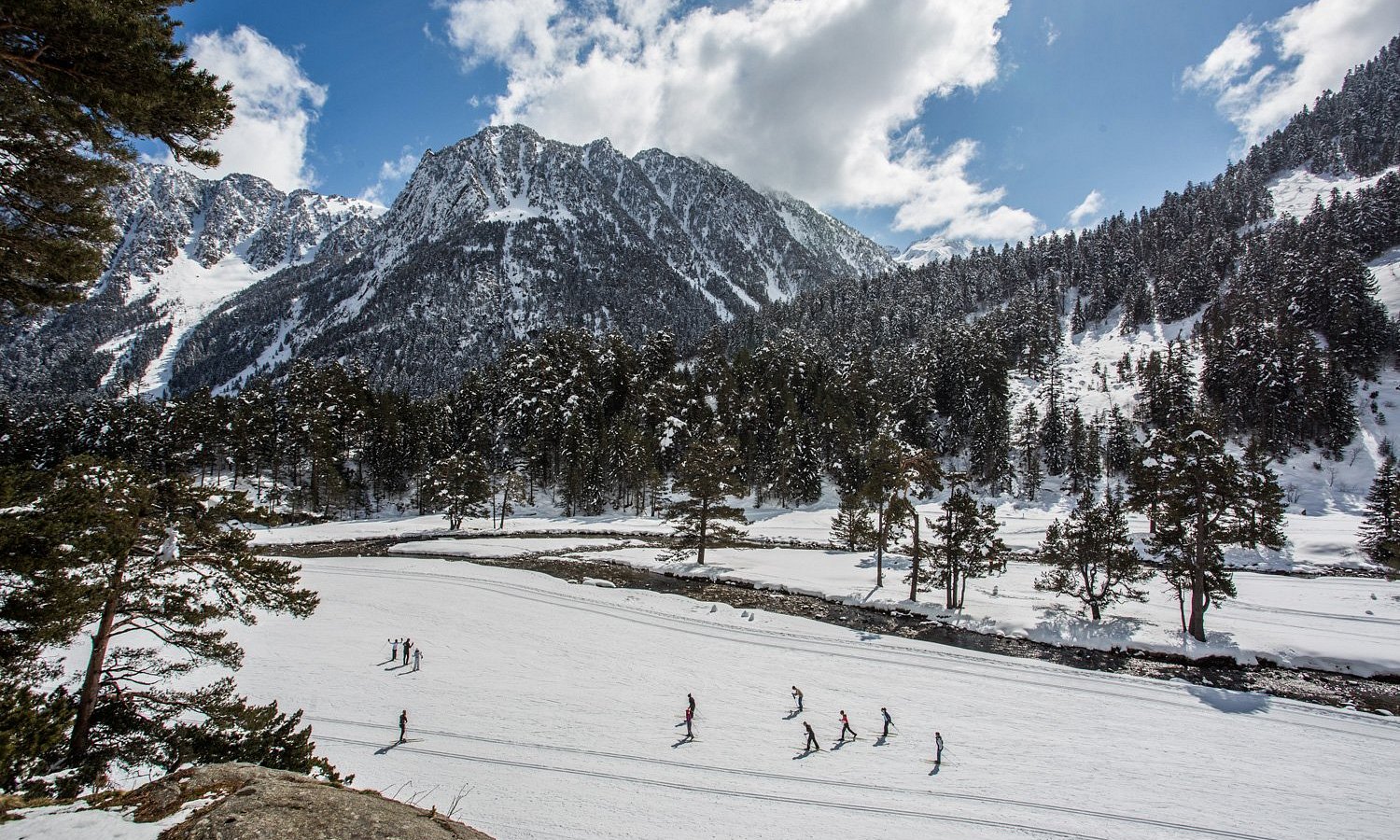 Pont d'Espagne in France - a group of people skiing down a snow covered mountain.