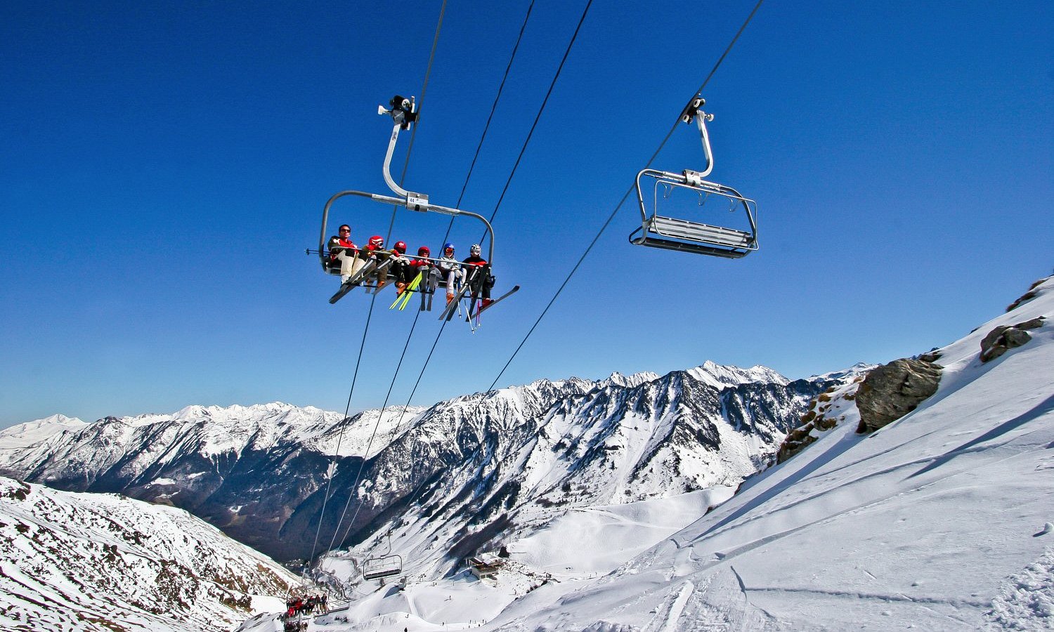 Pont d'Espagne in France - two people on a ski lift in the mountains.
