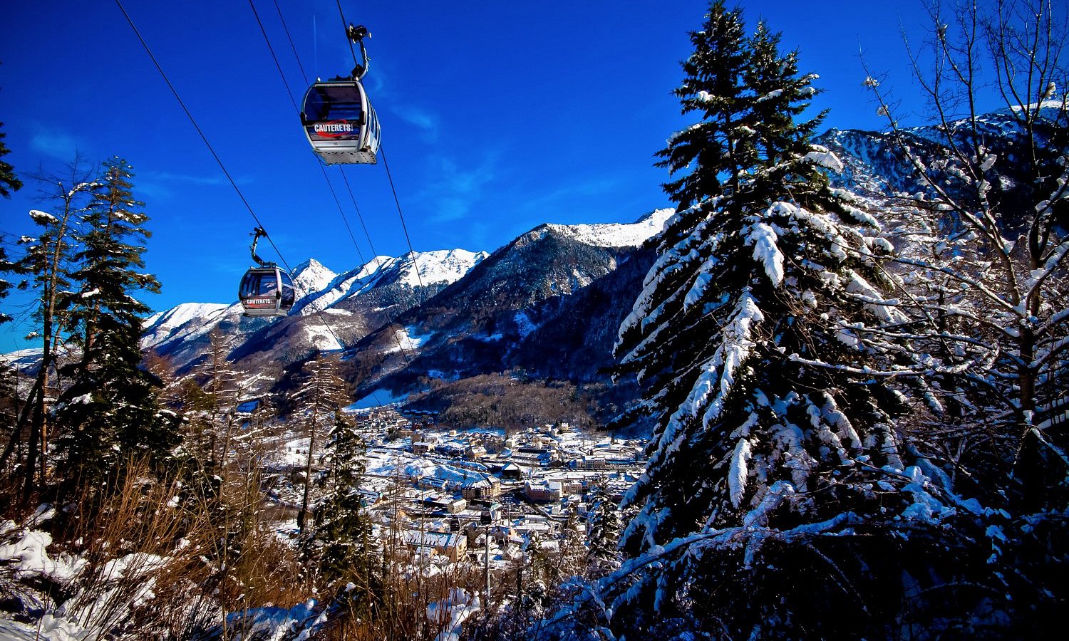 Pont d'Espagne in France - a ski lift going up a snowy mountain.