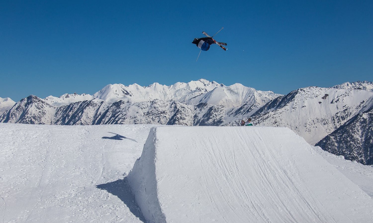 Pont d'Espagne in France - a man flying through the air while riding a snowboard.