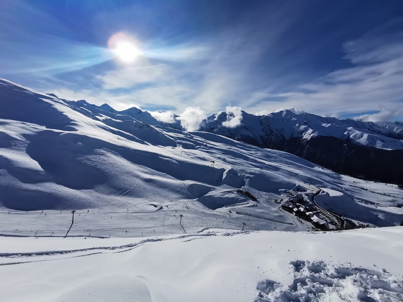 Peyragudes in France - the sun is shining over the snowy mountains.