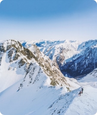 A vibrant winter scene at Peyragudes ski resort in France featuring a skier enjoying the snow-covered slopes. Majestic mountains form the backdrop with a charming chalet adding to the alpine ambiance.