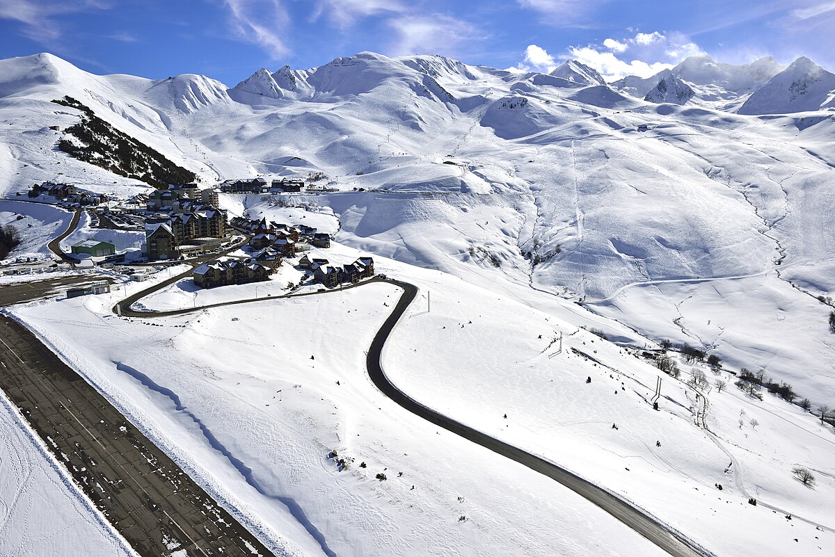 Peyragudes in France - a snow covered mountain with a road going through it.