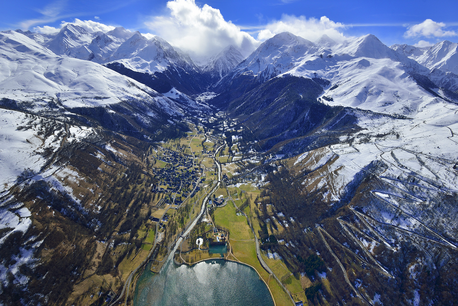Peyragudes in France - a large body of water surrounded by mountains.