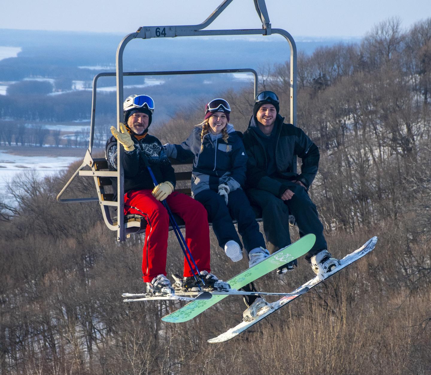 Chestnut Mountain in USA - two people sitting on a ski lift.