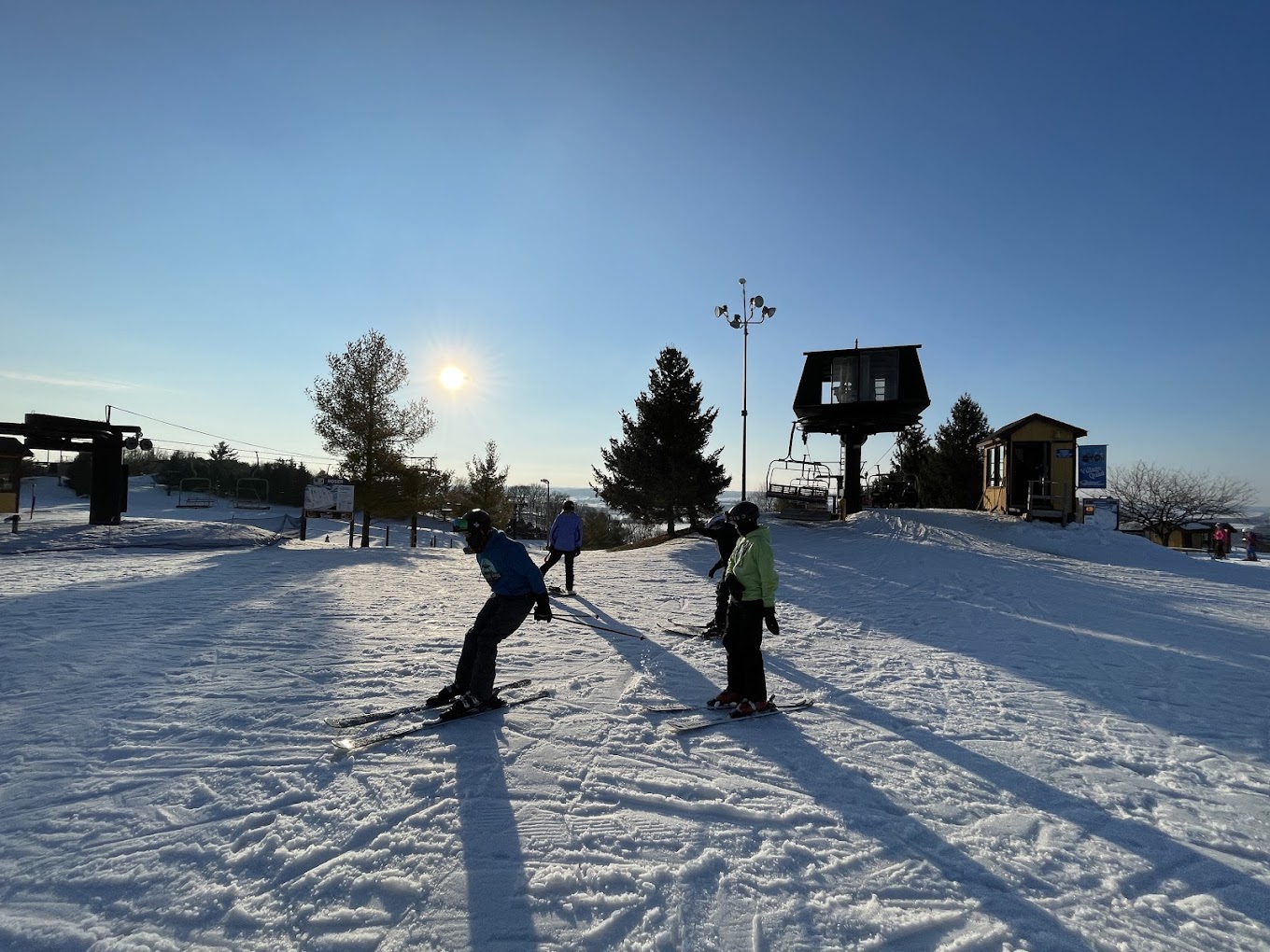 Chestnut Mountain in USA - two people are skiing down a snowy hill.