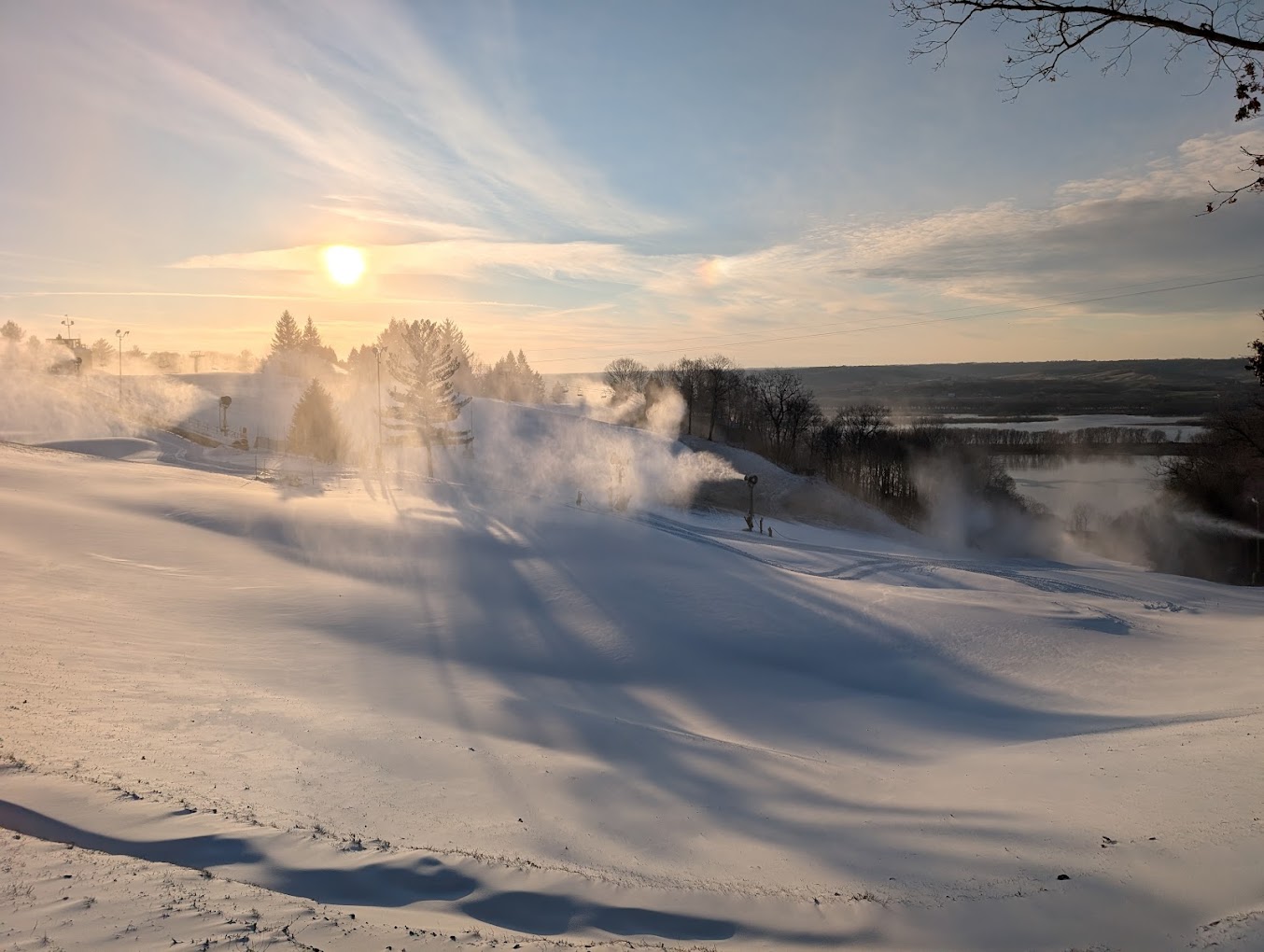 Chestnut Mountain in USA - the sun is shining over a snowy landscape.