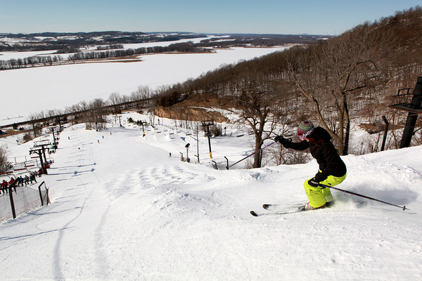 Chestnut Mountain in USA - a person riding skis down a snowy slope.