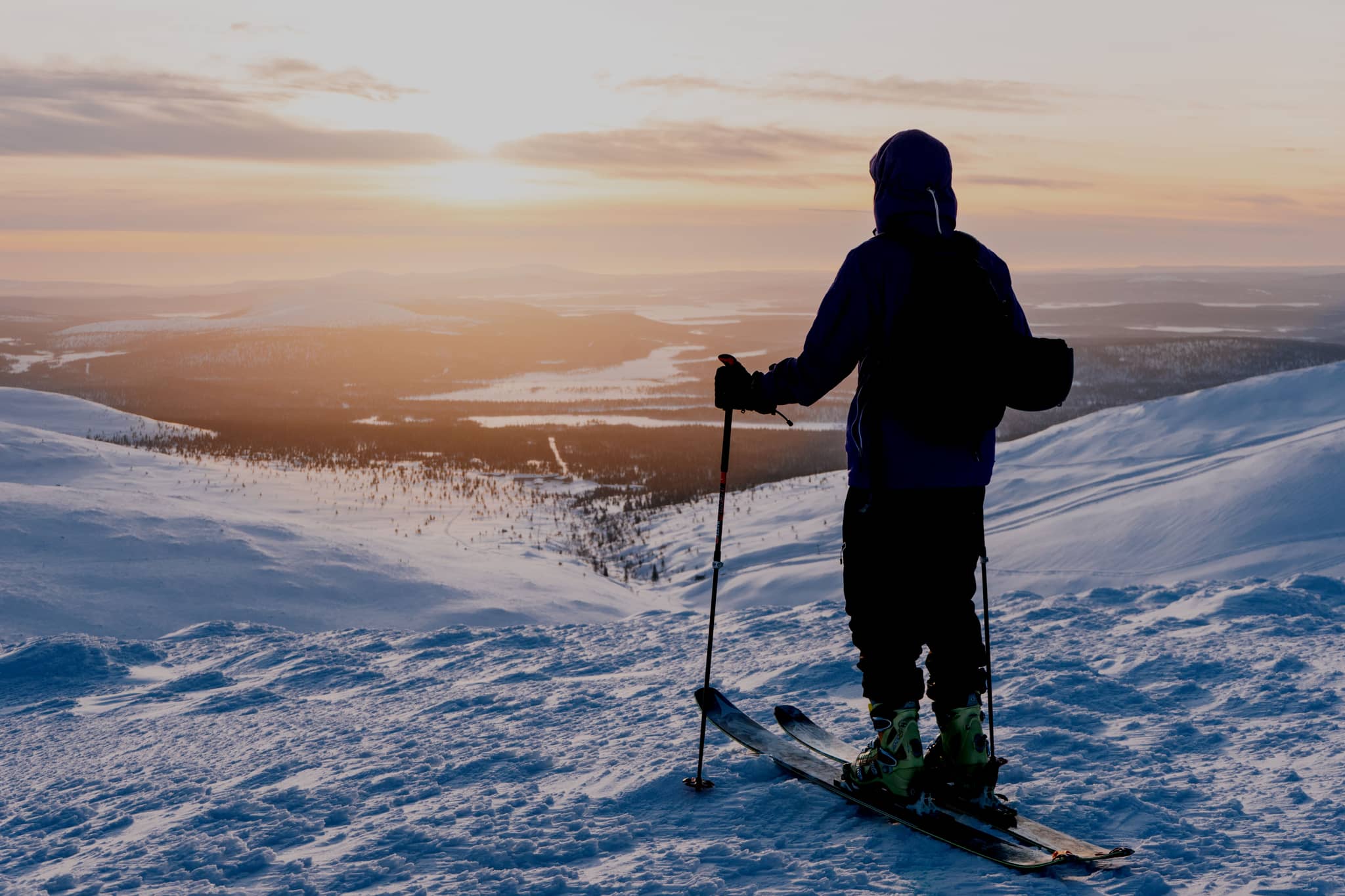 Pallas in Finland - a person standing on top of a snow covered mountain.
