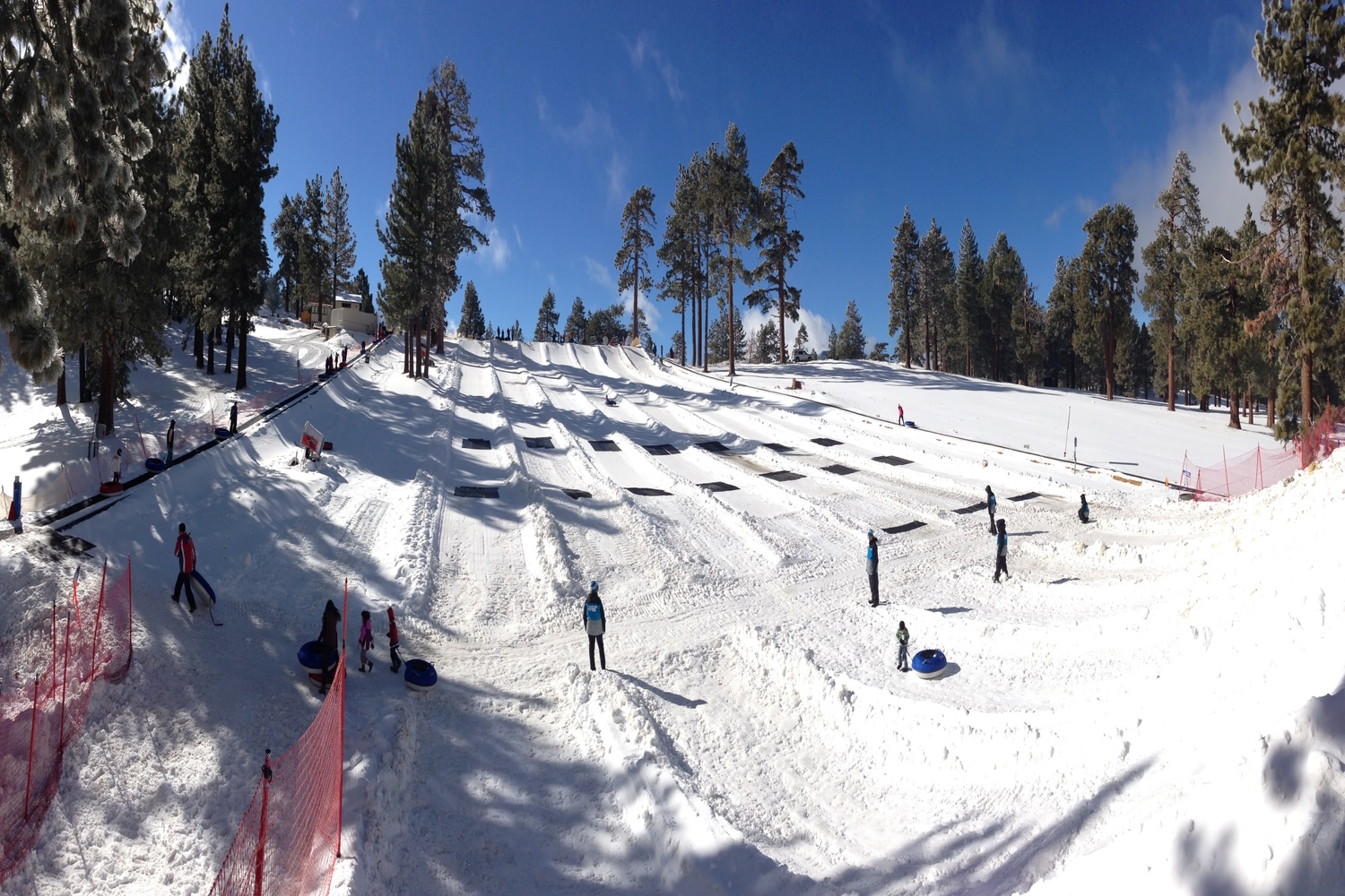 Mountain High North in USA - a group of people skiing down a snowy slope.