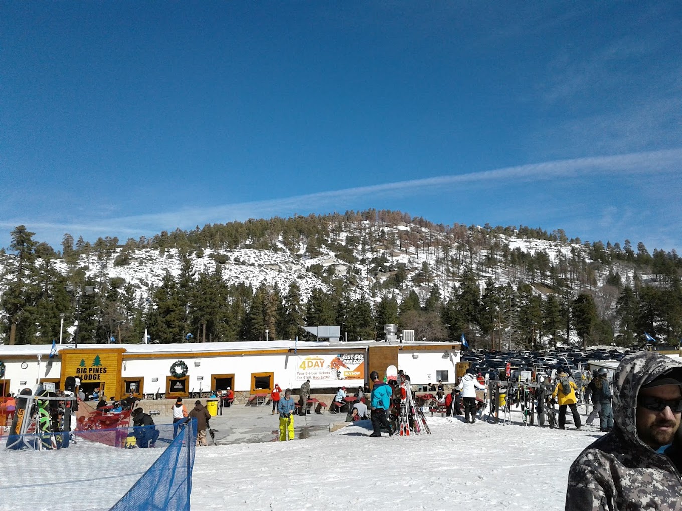 Mountain High North in USA - a group of people standing on top of a snow covered slope.