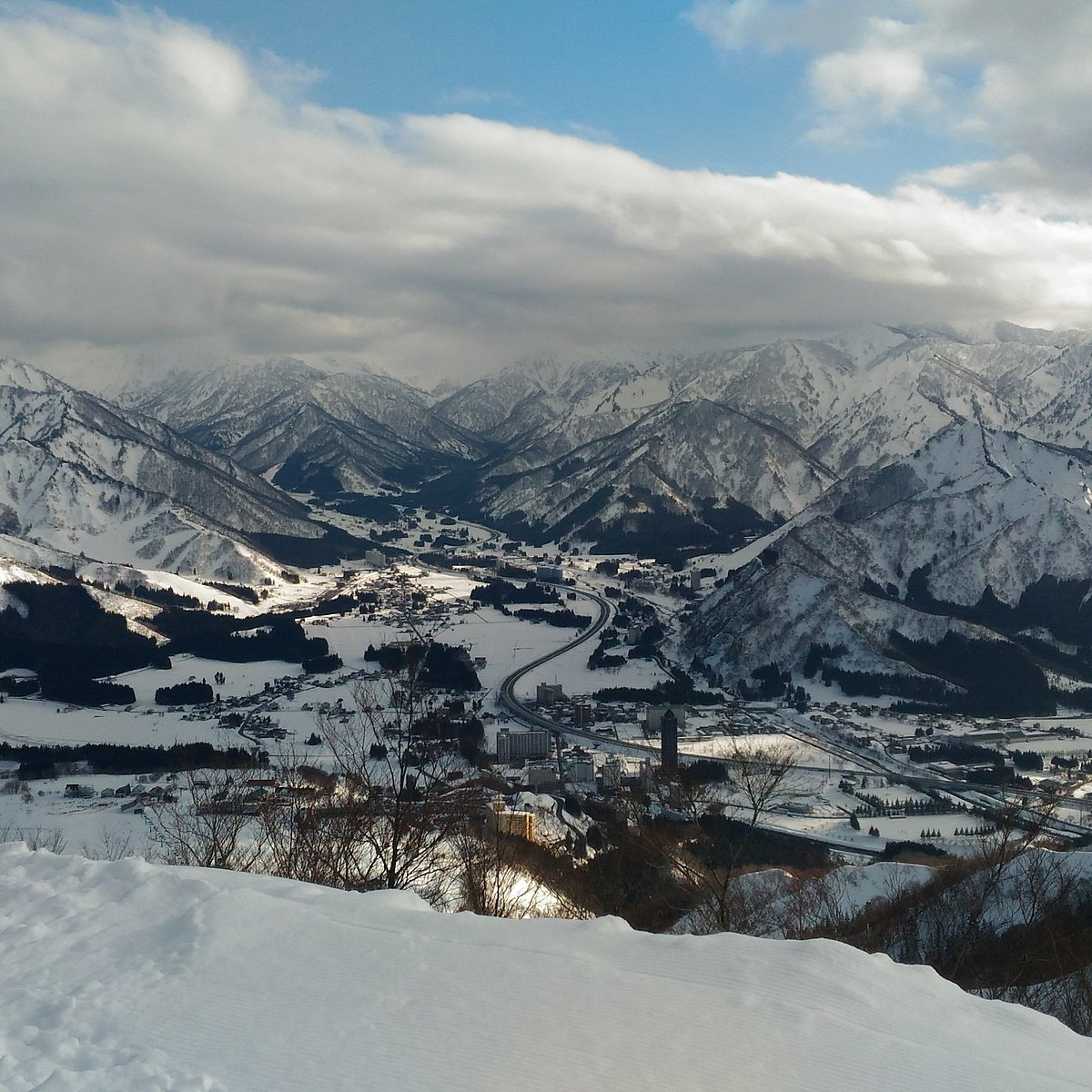 Yuzawa Park in Japan - a view from the top of a snowy mountain.