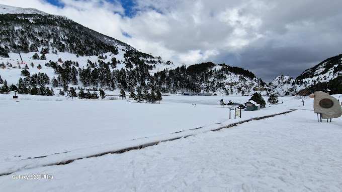 Vall de Núria in Spain - a snow covered ski slope with trees in the background.