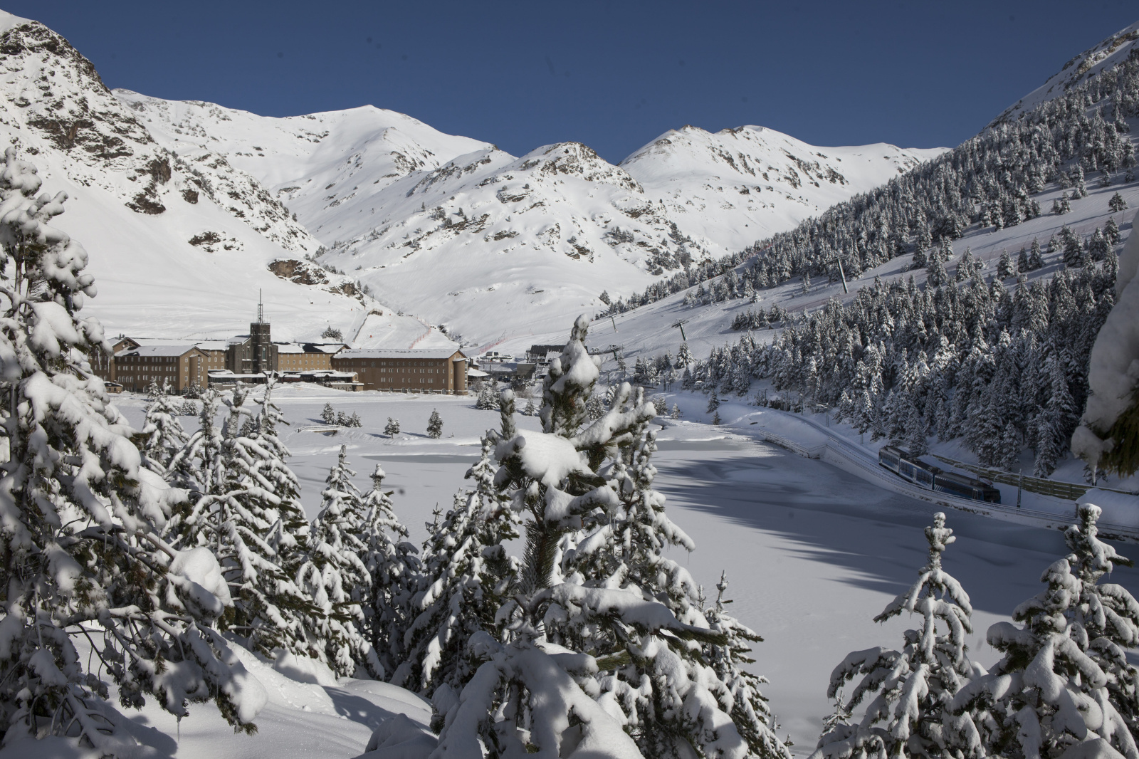Vall de Núria in Spain - trees covered in snow.