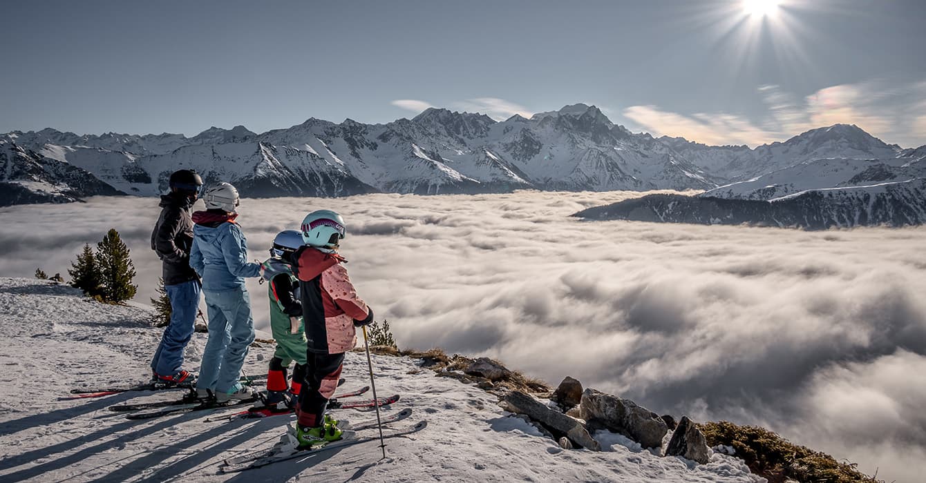 La Forclaz in Switzerland - two people standing on top of a snow covered mountain.