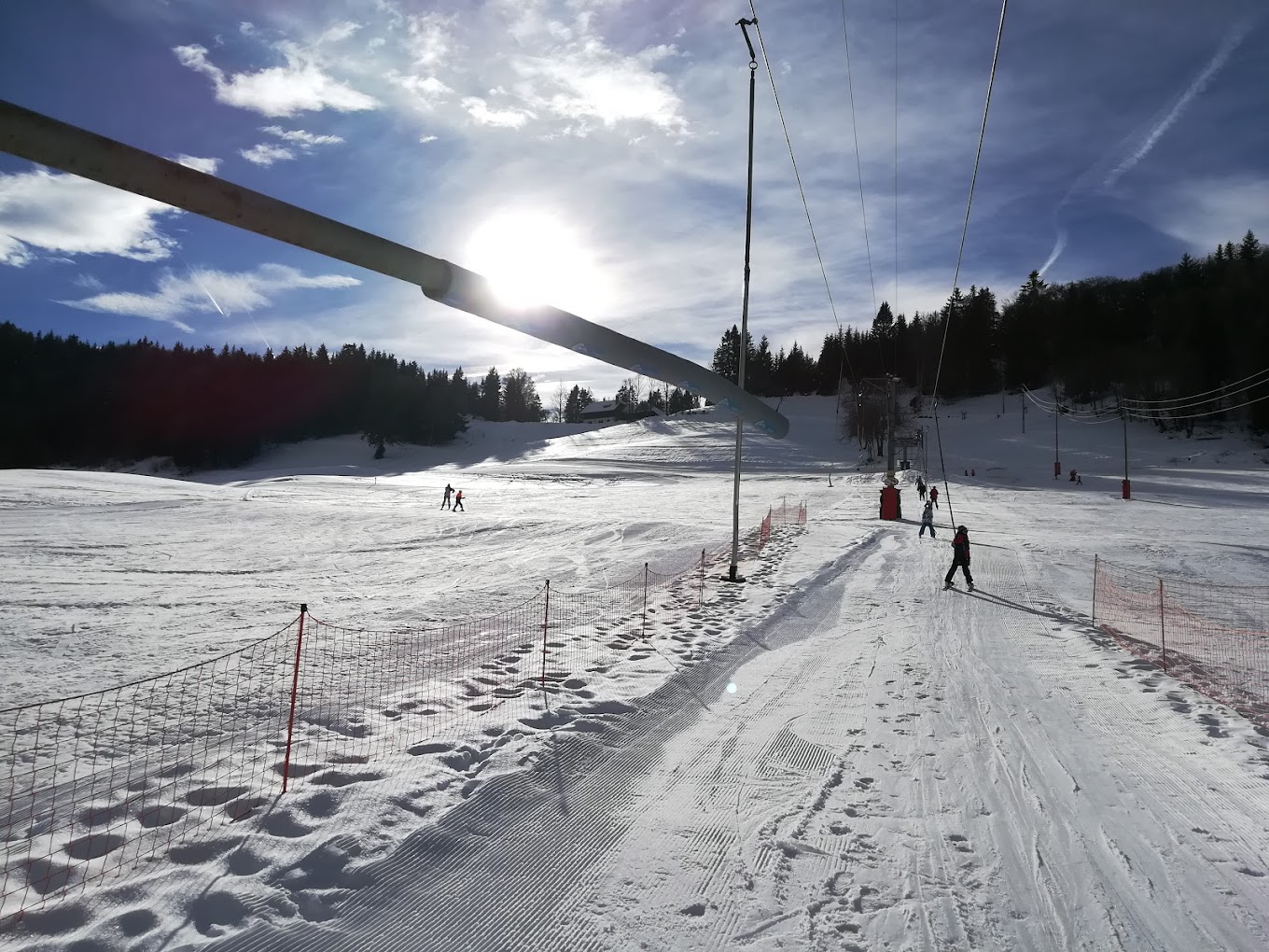 La Forclaz in Switzerland - a ski slope with people skiing down it.