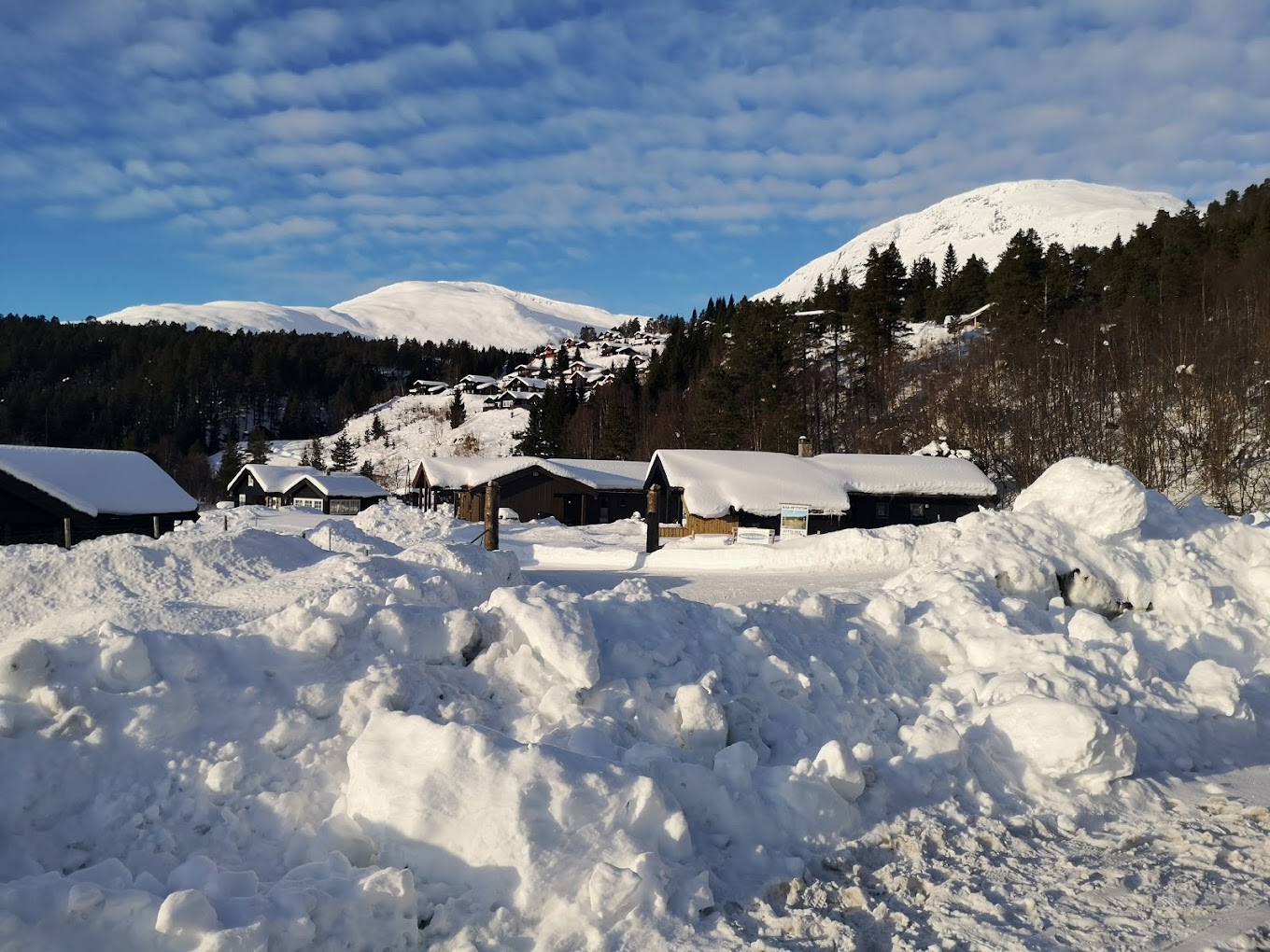 Stryn Vinterski in Norway - a large pile of snow in front of a mountain.