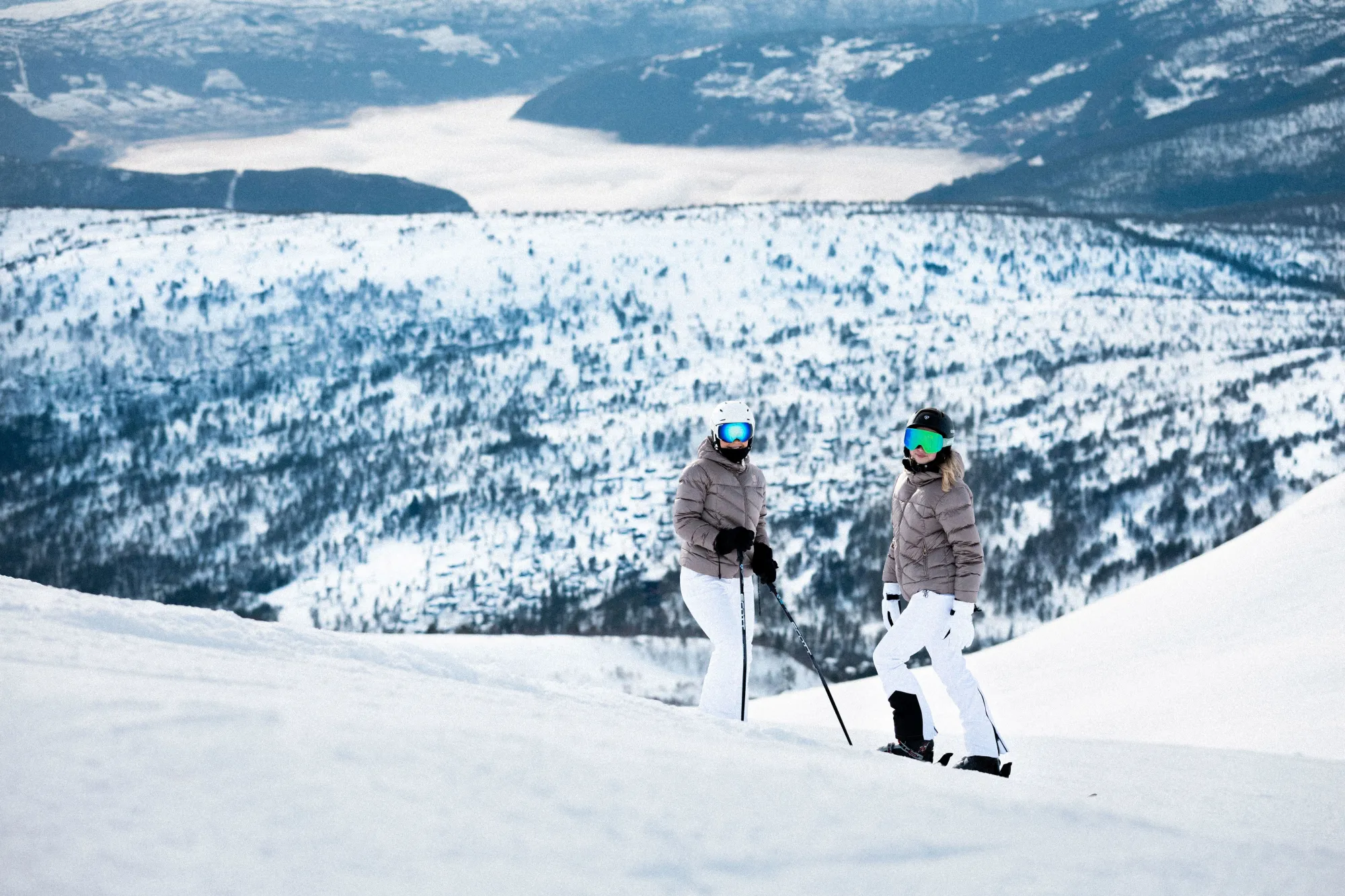 Stryn Vinterski in Norway - two people are skiing down a snowy hill.