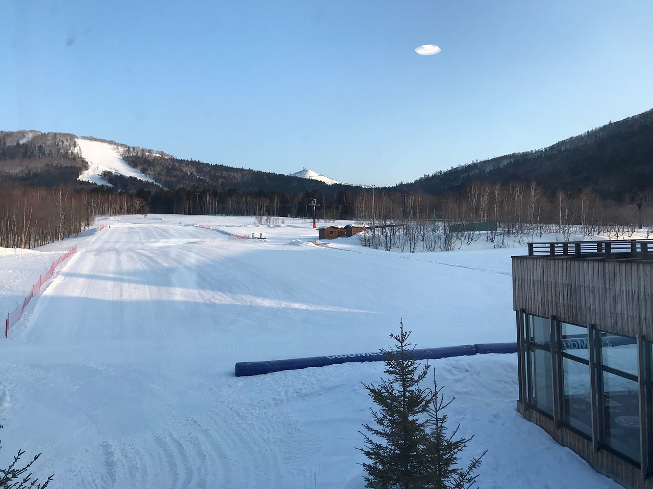 Engaru Rock Valley in Japan - a snow covered ski slope with trees and mountains in the background.