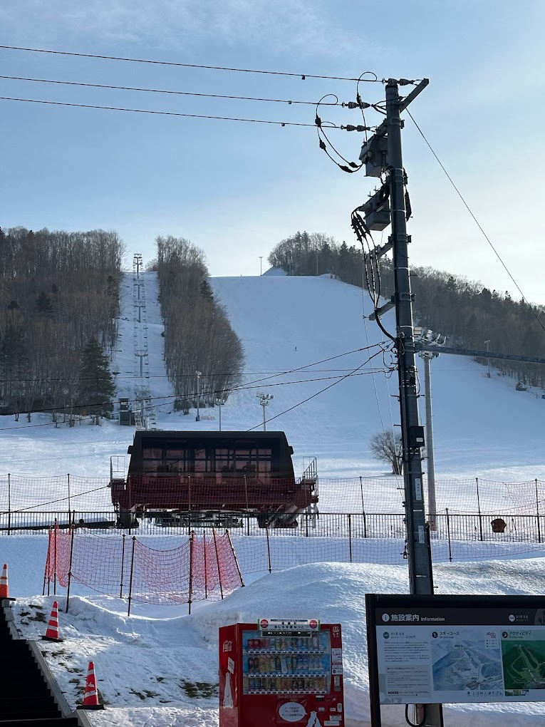 Engaru Rock Valley in Japan - a ski lift going up a snowy hill.