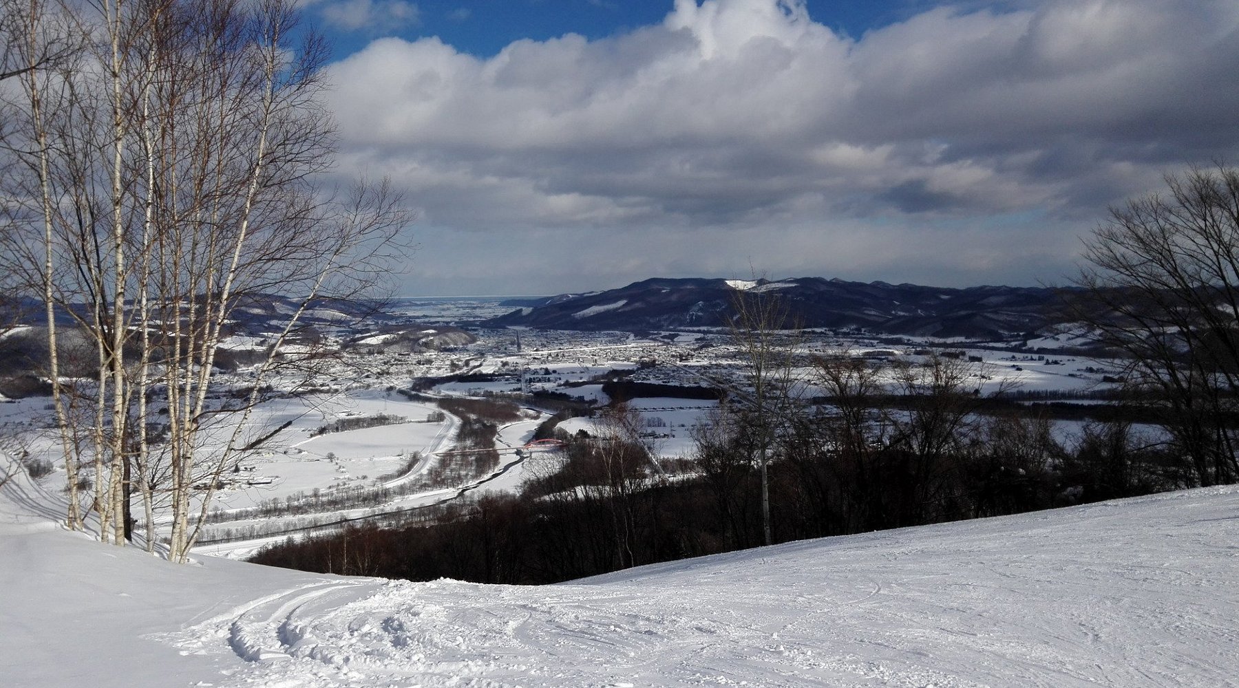 Engaru Rock Valley in Japan - a view from the top of a snowy hill.