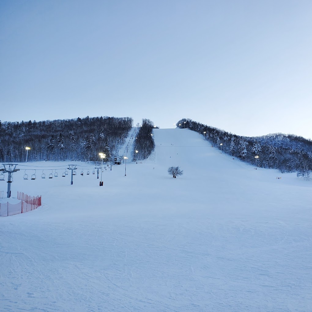 Engaru Rock Valley in Japan - a ski slope covered in snow at dusk.