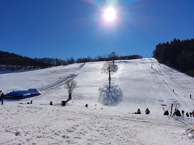 Les Plans d'Hotonnes in France - a group of people skiing down a snow covered hill.