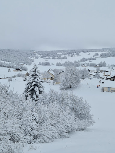 Les Plans d'Hotonnes in France - a view of a snowy village in the mountains.