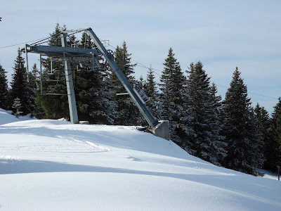 Le Noirmont in France - a ski lift going up a snowy hill.
