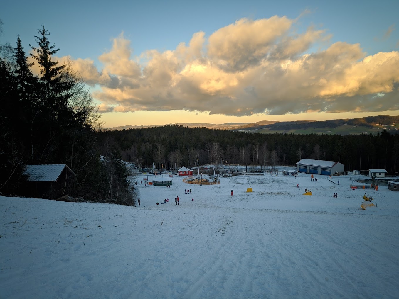 Hohenbogenbahn in Germany - a group of people playing in the snow.